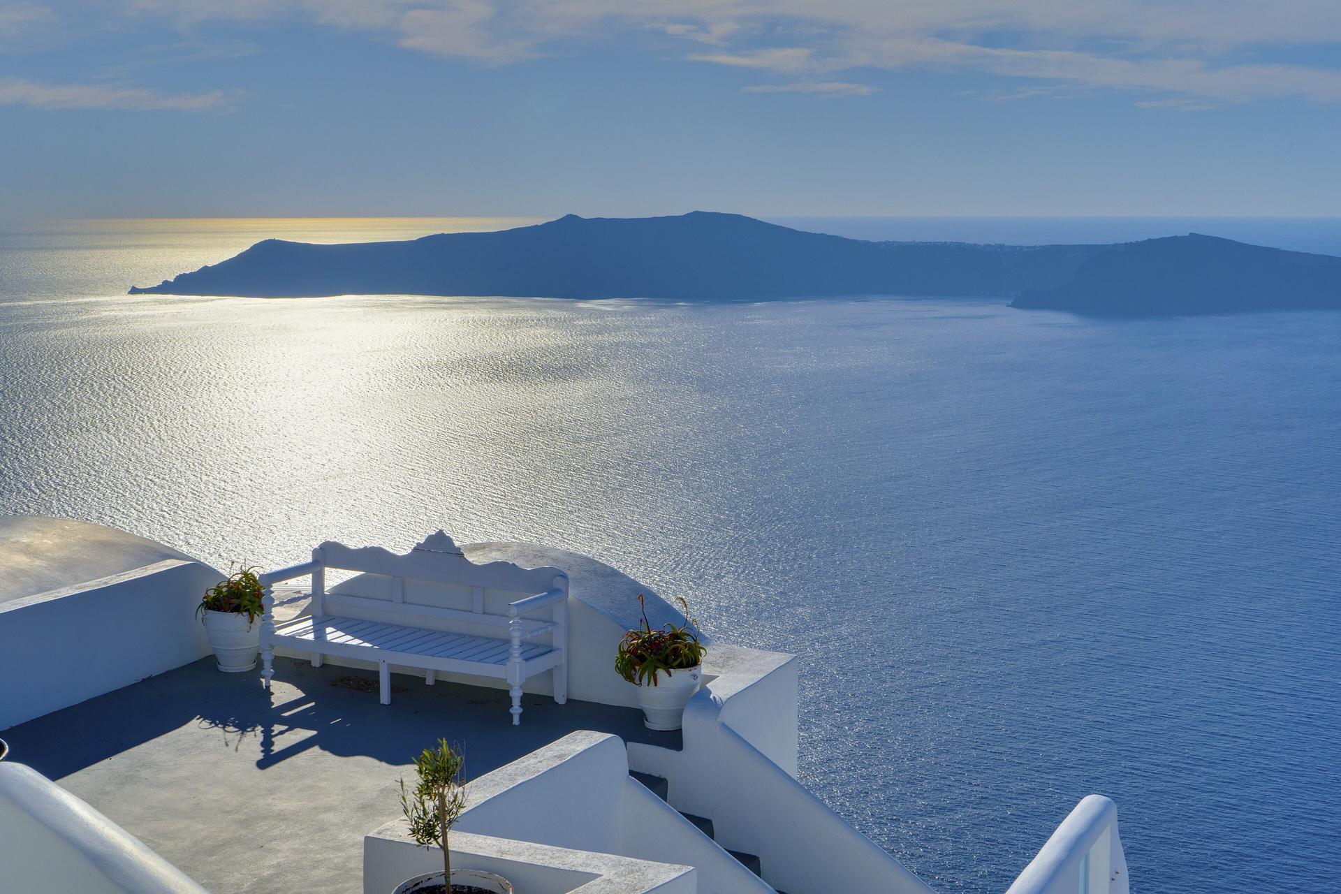 Whitewashed terrace in Oia overlooking the Santorini caldera, Greece